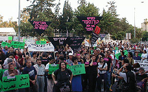 People, banners and signs at the Jerusalem demonstration