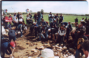 Peace activists try to move the hard earth - Photo  © 2001 by Rachel Avnery